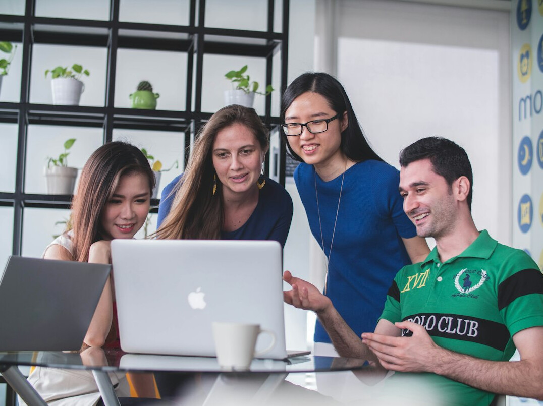 group of friends coding together