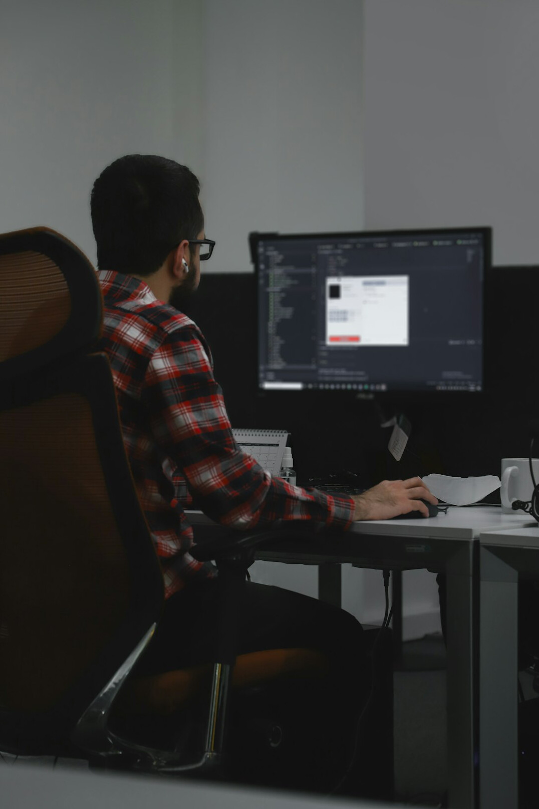 successful programmer at desk