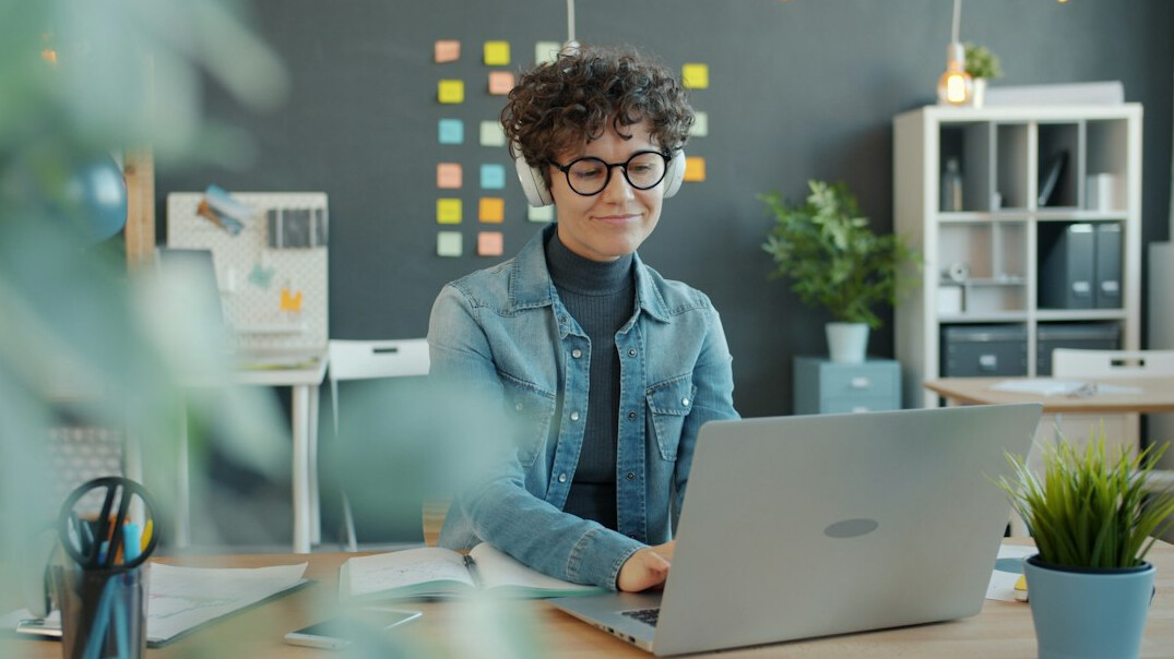 woman coding at home office